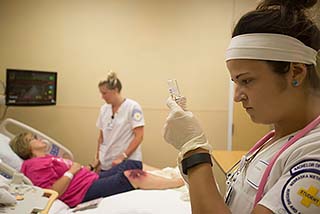 Nursing Student Prepares an Injection