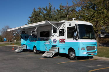 Nebraska Methodist College's mobile diabetes center. A blue and white bus with the words "Mobile Diabetes Center" printed on the side
