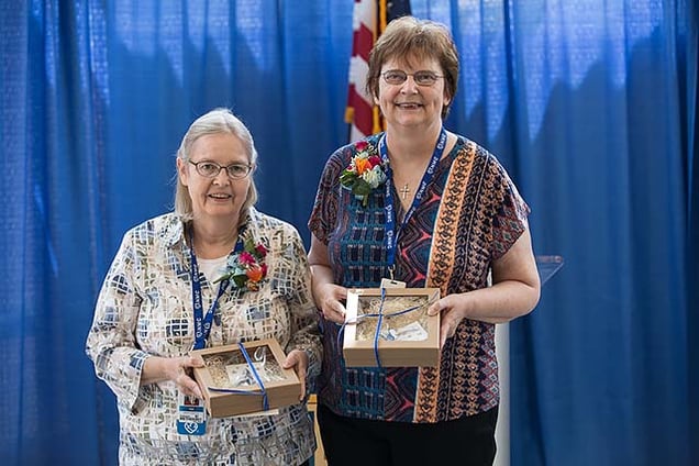 Tem Adair and Bev Sedlacek celebrate their retirement after a combined 39 years of service to Nebraska Methodist College.