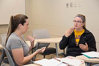 Students practice with each other during Patti Reitz's Healthcare Sign Language class. Students practice with each other during Patti Reitz's Healthcare Sign Language class.