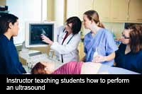 Instructor teaching ultrasound to NMC students