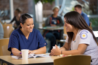 Students studying in the dining area.