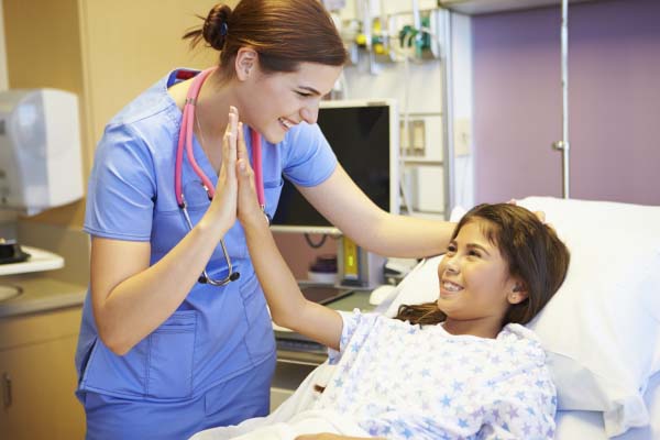 Nurse talking with young patient