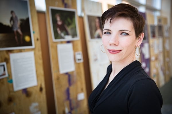 Teresa Prince Conway with her "Survivor Stories" exhibit, debuting at Nebraska Methodist College during Sexual Assault Awareness Month.