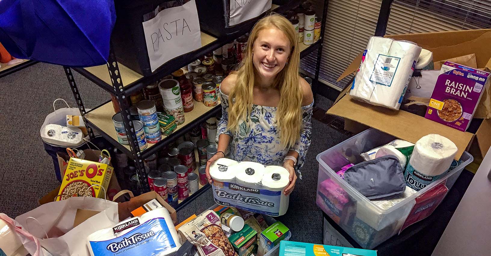 Methodist Volunteen Megan Jacobsen with the 550+ items donated to the NMC Food Pantry.