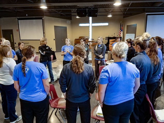 Dr. Jillian Sisson instructs the NMC team before the Foot Care Clinic begins.