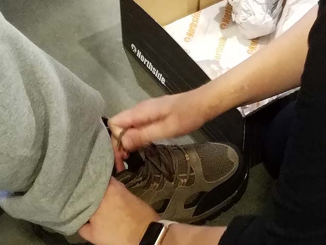 Closeup of tying laces of new boot received at Foot Care Clinic.