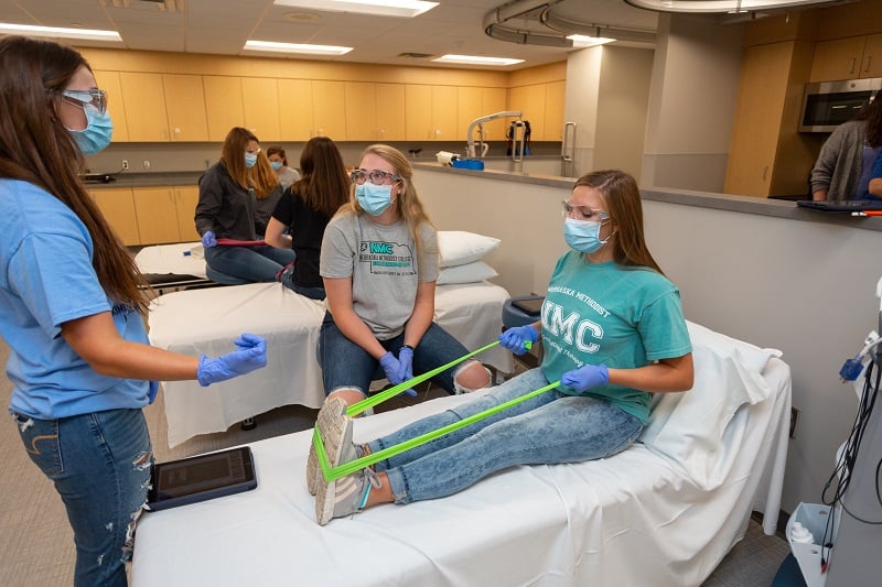 The coursework in the NMC MOT and PTA programs are so up-to-date that students are already working on treatment for patients recovering from COVID-19. Students practice doing stretches that reduce oxidative stress in various tissues and muscles.