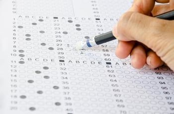 A student filling out a Scantron for an AP Exam