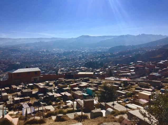A downward shot of a Bolivia with mountains in the background.