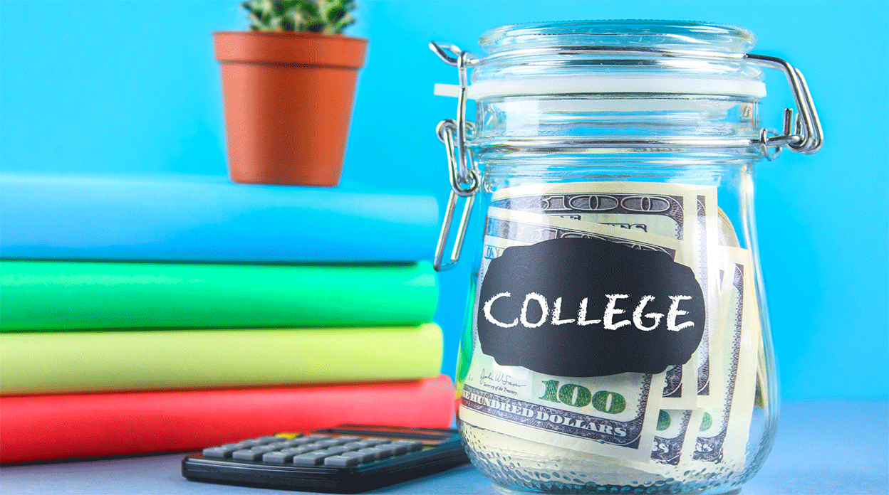 A jar filled with $100 bills with a label that reads, "college" alongside a stack of books and a calculator.