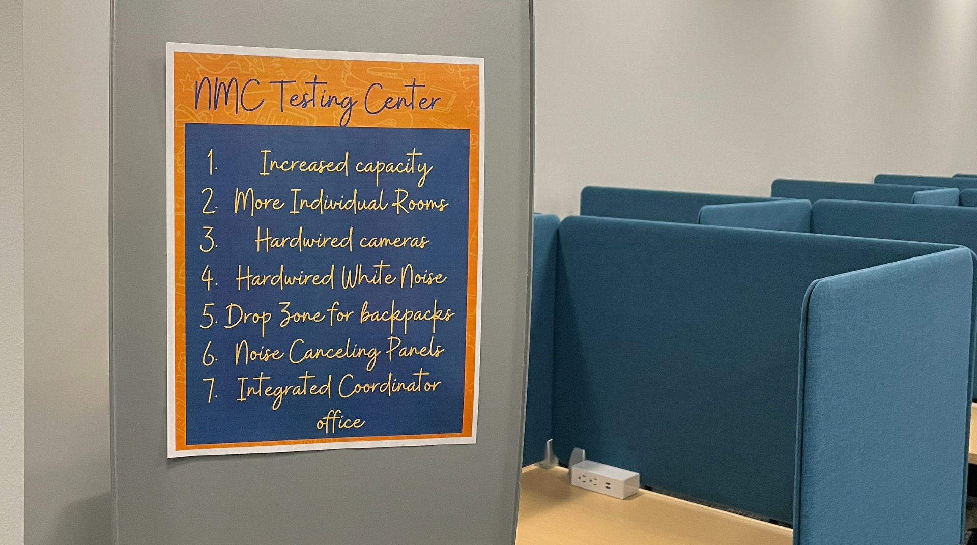 A photograph of Nebraska Methodist College's accessible testing center, showing a sign that lists the center's features and the individual testing spaces.