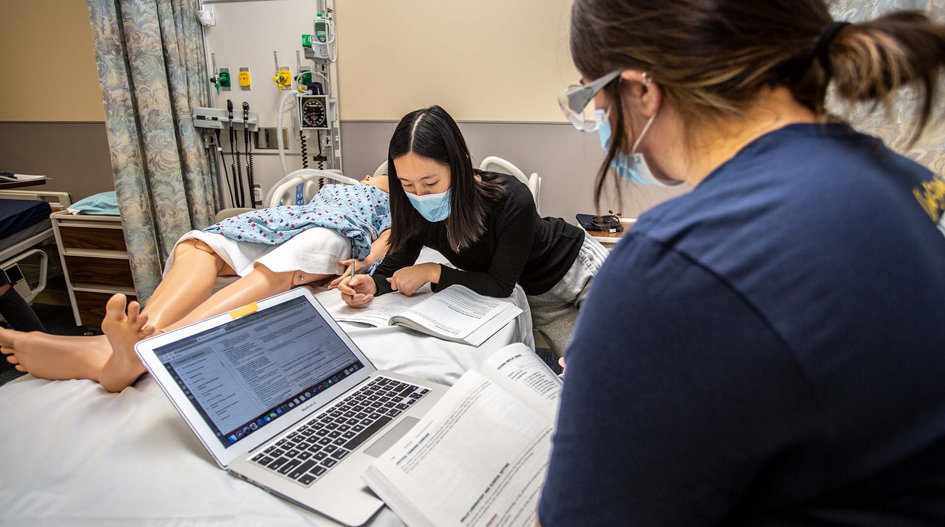 Nursing students studying in a lab at Nebraska Methodist College.