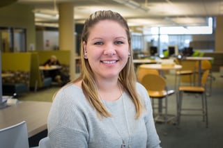 Nursing Student Jess sitting in the NMC library