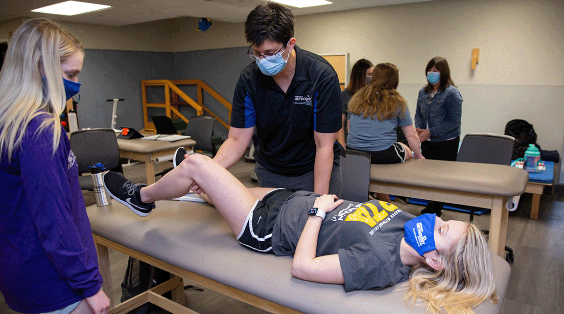 Nebraska Methodist College Physical Therapist Assistant Director Shannon Struby teaches students in a classroom.