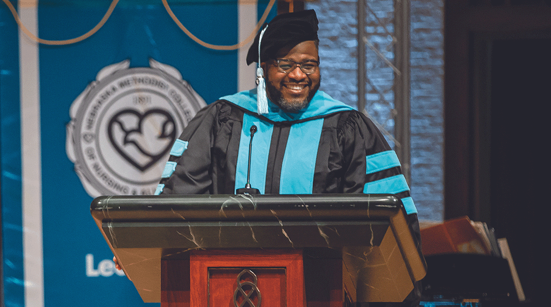 Alumni Derrick Traylor speaks at Nebraska Methodist College's graduation ceremony in 2021.