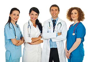 Four Nurses standing side by side