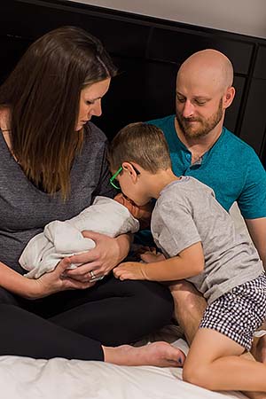 Christa, Joe and Truman welcome Baby Macklin.