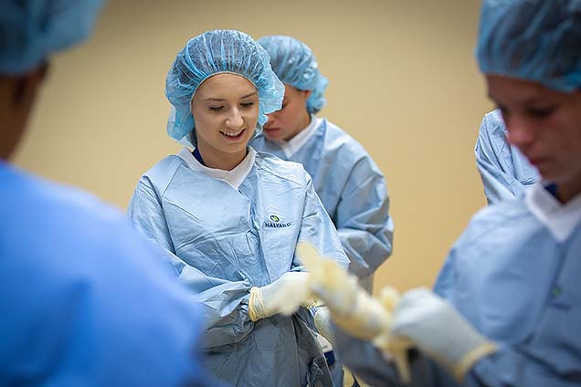 Lyndsay H., a Methodist Hospital volunteen, shown participating in the surgical technology class at NMC’s Summer High School Healthcare Career Camp.