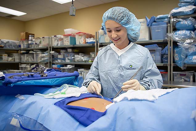 Lyndsay H., a Methodist Hospital volunteen, shown participating in the surgical technology class at NMC’s Summer High School Healthcare Career Camp.