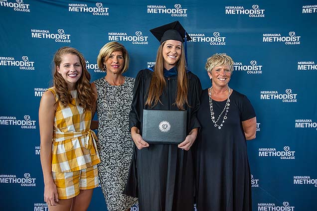 New MOT grad Megan Vermeer with her sister, mother and Aunt Gina.