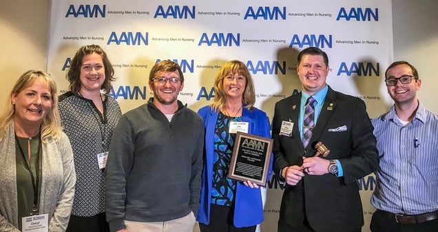 Shown at the AAMN Conference with the 2018 Best Schools Award, from left: NMC Assistant Professor Cheryl Bouckaert, MSN, BSN, RN; NMC BSN-DNP Program Director Tara Whitmire, DNP, APRN-NP; NMC DNP student and alumnus Troy Beekman BSN, RN; NMC President/CEO Deb Carlson, PhD; AAMN President and NMC alumnus Blake Smith, MSN, BSN, RN; NMC ACE Program nursing student Nathan Johnson.