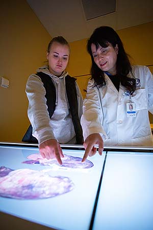 NMC student Abbie Carlson and Dr. Sophie Feng with the Anatomage table. 