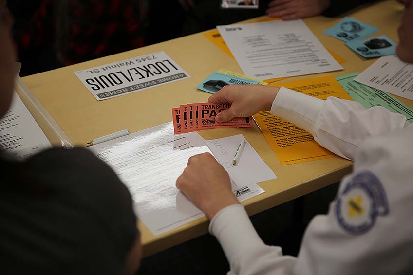 Each poverty simulation kit comes with a family packet with a family scenario and accessories.