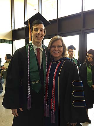 Beth Hultquist poses for a photo with one of her Baylor nursing students at graduation.