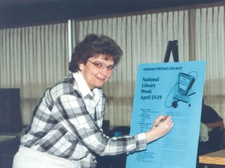 In this historic photo, Nebraska Methodist College Directory of Library Services Bev Sedlacek gets ready for National Library Week.