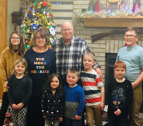 Peggy Dyer and her family posing for a Christmas photo