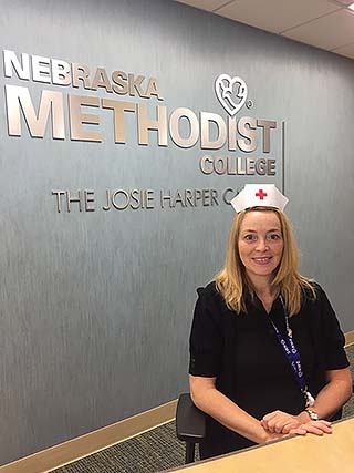 NMC Admissions Support Representative Holly Brown models a vintage nurses hat.