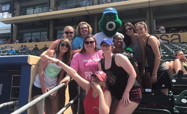 Nebraska Methodist College students pose for a photo with the Storm Chasers mascot.