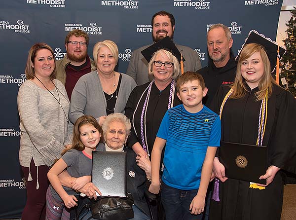 Lisa & Cassandra surrounded by family after fall commencement. 