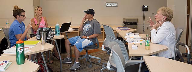 Patti Reitz (far right) oversees a sign language class at Nebraska Methodist College.