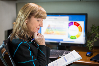 A medical assistant working at a computer